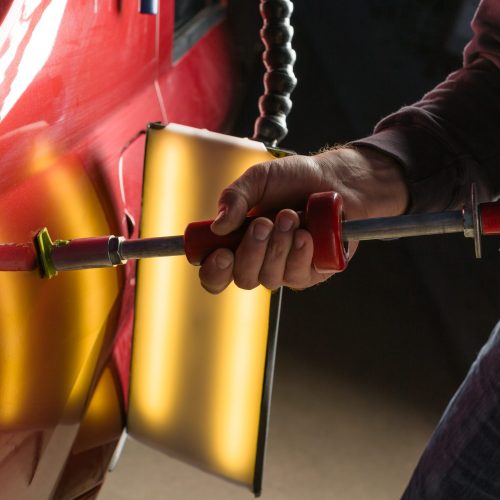 repairing-car-dent-after-accident-by-paintless-dent-repair
